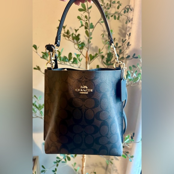 Coach Handbags - Coach Brown and Black Signature mollie bucket Bag